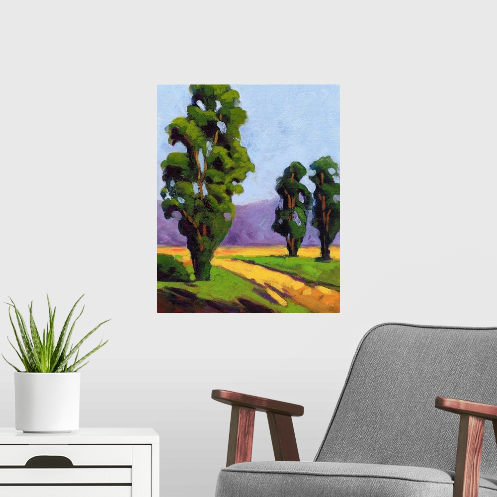 A modern room featuring A contemporary painting of a small country road framed by Eucalyptus  trees.
