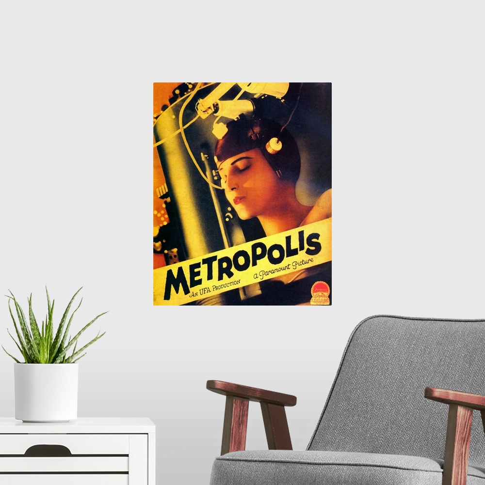 A modern room featuring Big, vertical movie advertisement for the silent film Metropolis, from 1927.  An image of a woman...