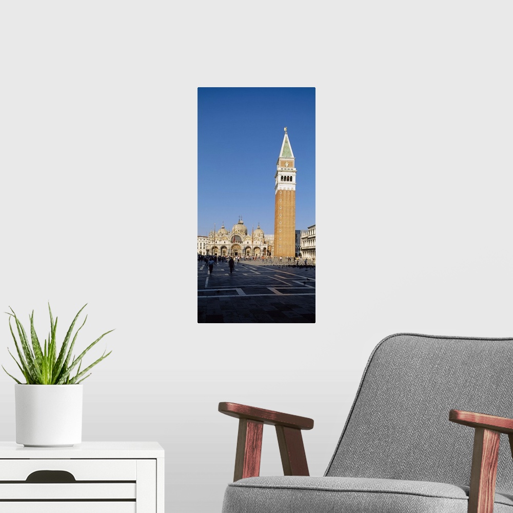 A modern room featuring Bell tower with a cathedral in the background, St. Marks Cathedral, Venice, Italy