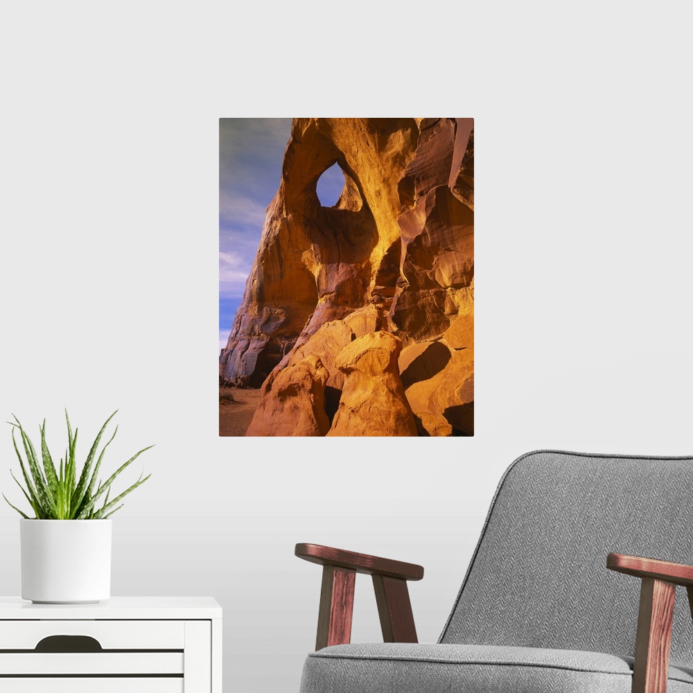 A modern room featuring Low angle view of a natural arch, Suns Eye Arch, Monument Valley Tribal Park, Arizona