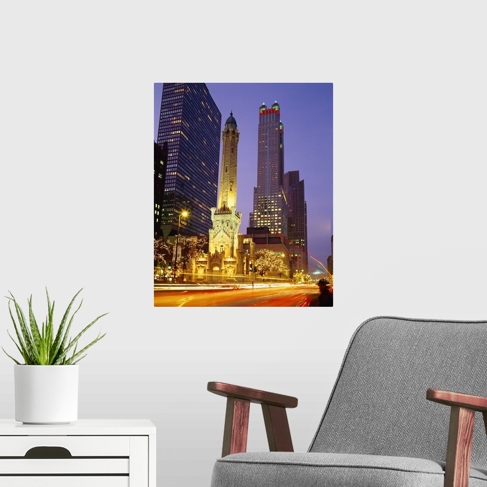 A modern room featuring Vertical photo taken from street level in Chicago looking up and a lit up old church with a moder...
