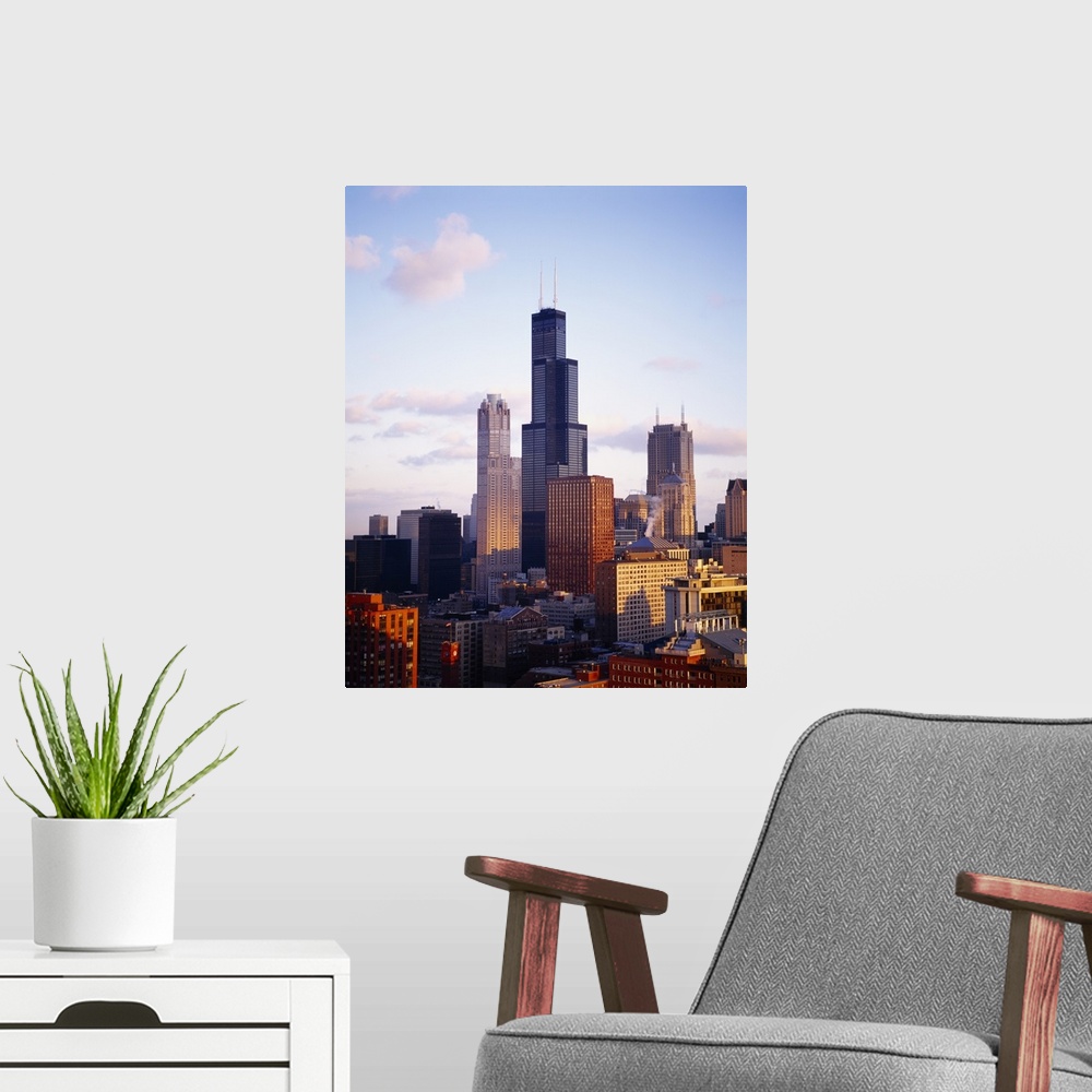 A modern room featuring This oversized piece is a photograph of buildings in Chicago with the Sears Tower in the middle d...