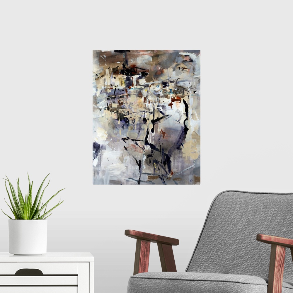 A modern room featuring Abstractly painted canvas of different areas of color on top of a neutral backdrop.