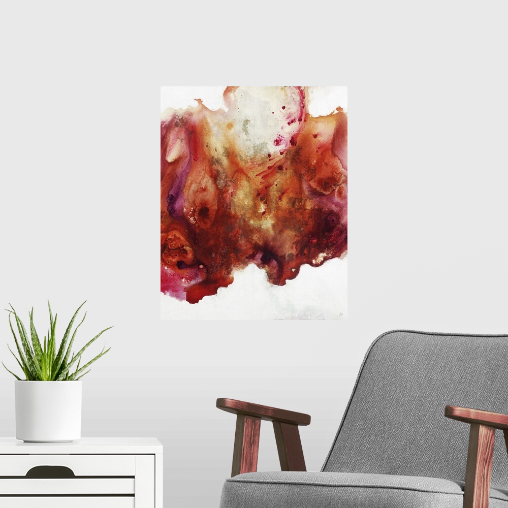 A modern room featuring Large abstract painting of vibrant colors of orange, red and pink.