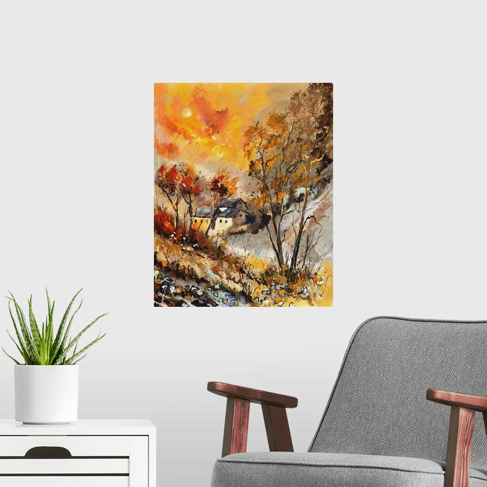 A modern room featuring Vertical painting of bare trees in a field of golden grass with a vibrant golden sky on an autumn...