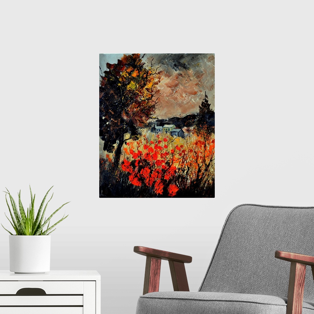 A modern room featuring An autumn scene of red blooming flowers in a field near a small village.
