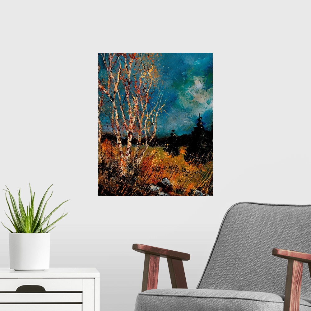 A modern room featuring Vertical painting of bare trees in a field of golden grass with a dark stormy sky.