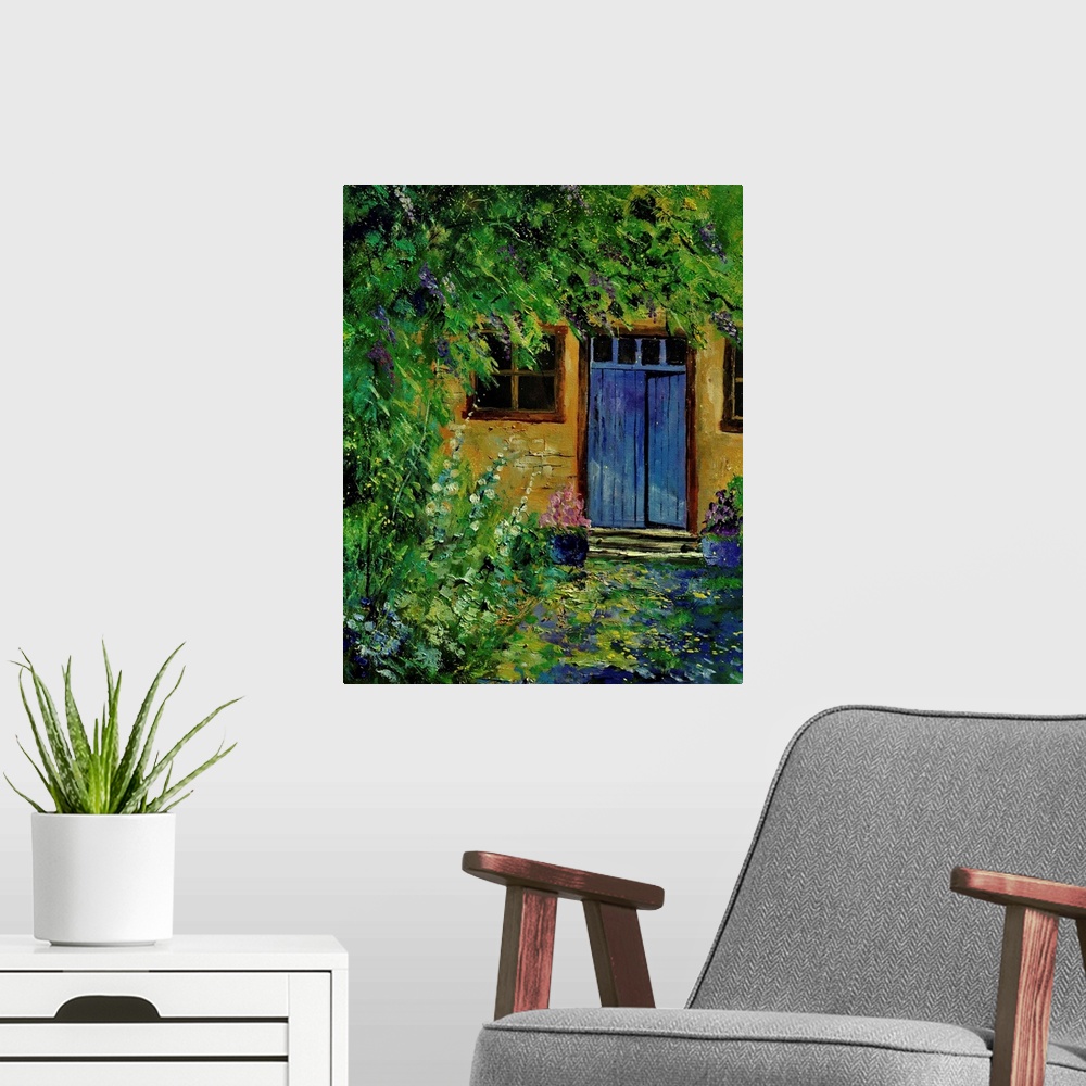 A modern room featuring Painting of a blue door to a building surrounded by a overgrown garden.