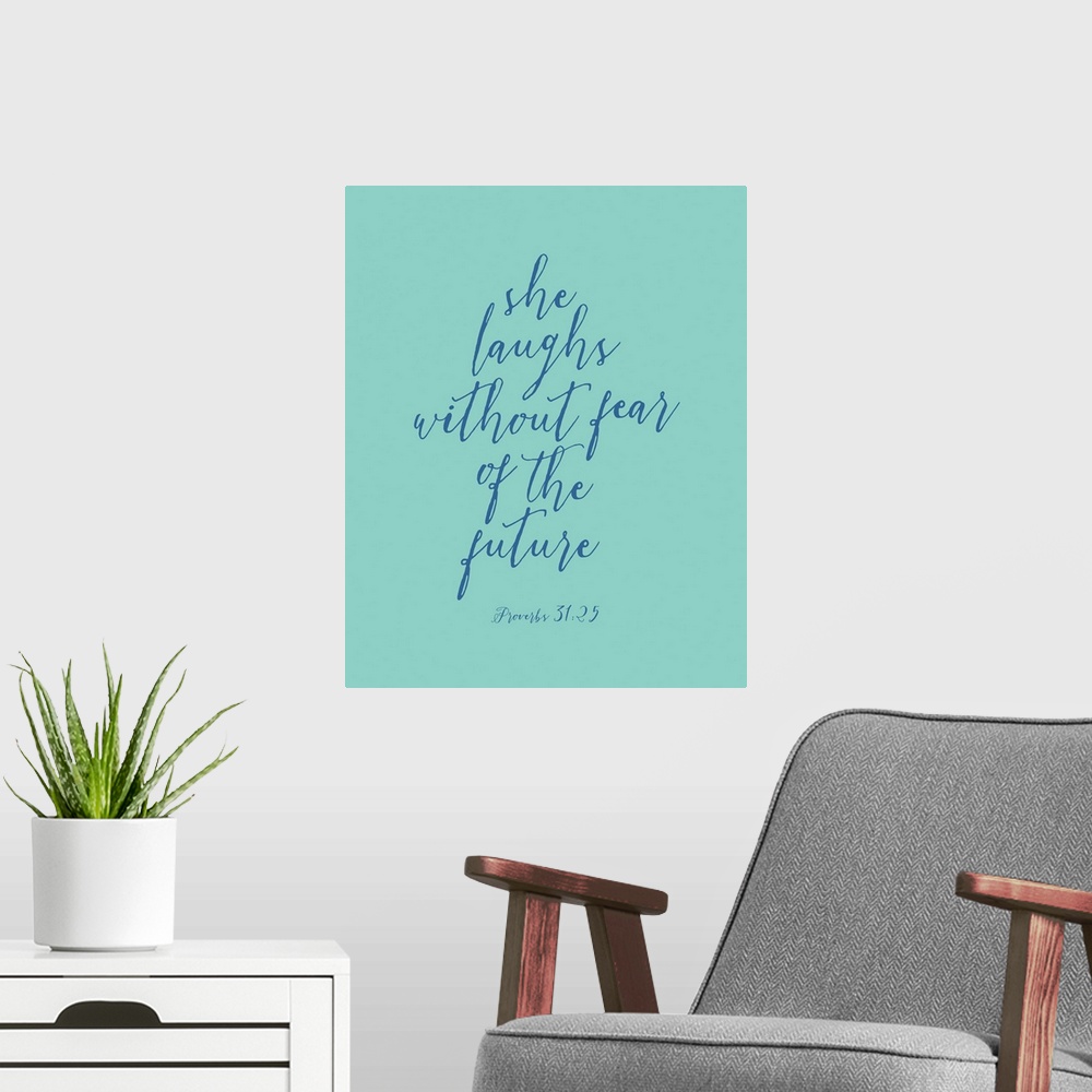 A modern room featuring Handlettered Bible verse reading She laughs without fear of the future.