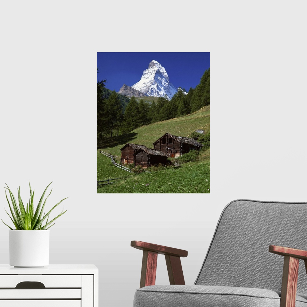 A modern room featuring The Matterhorn towering above green pastures, Zermatt, Valais, Switzerland