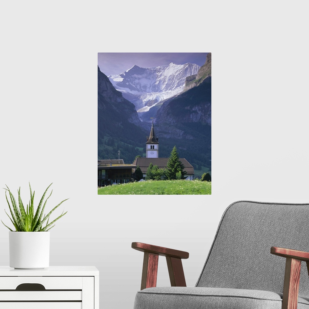 A modern room featuring Village church and Oberer Grindelwald Glacier, Swiss Alps, Switzerland