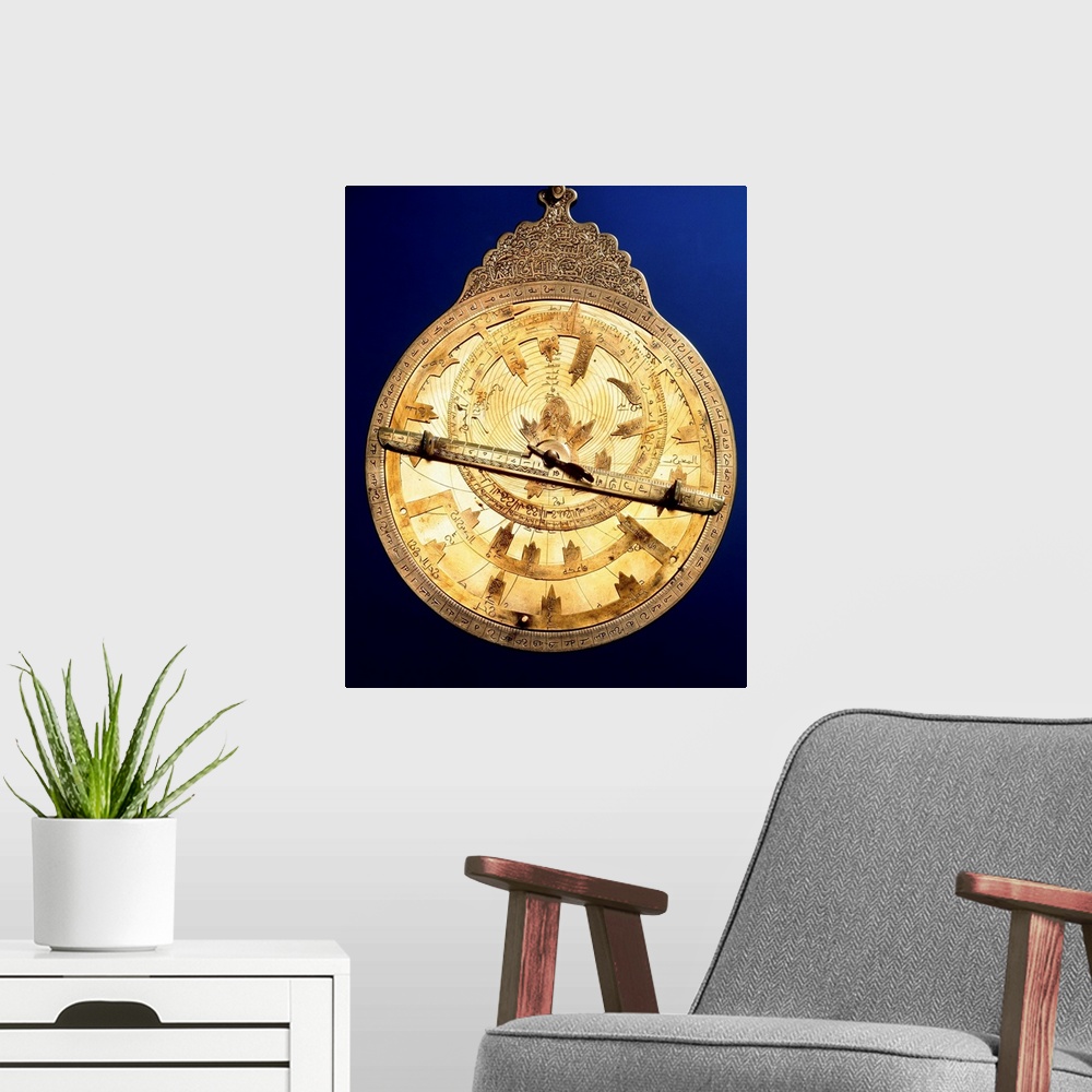 A modern room featuring Astrolabe. Brass astrolabe from the middle ages. The astrolabe consists of circles marked with an...