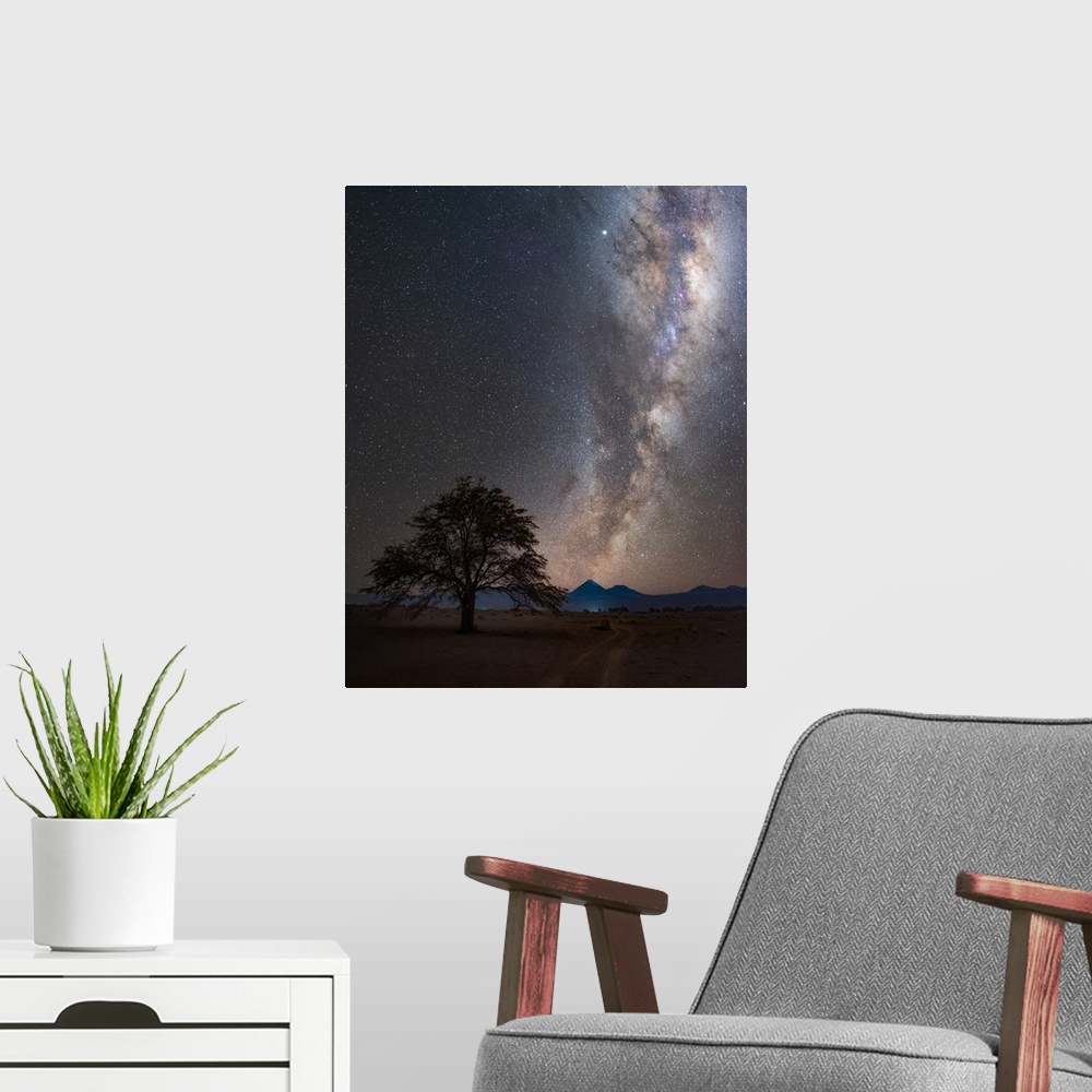 A modern room featuring Milky Way in the night sky over the desert village of San Pedro de Atacama, Chile. The galaxy is ...