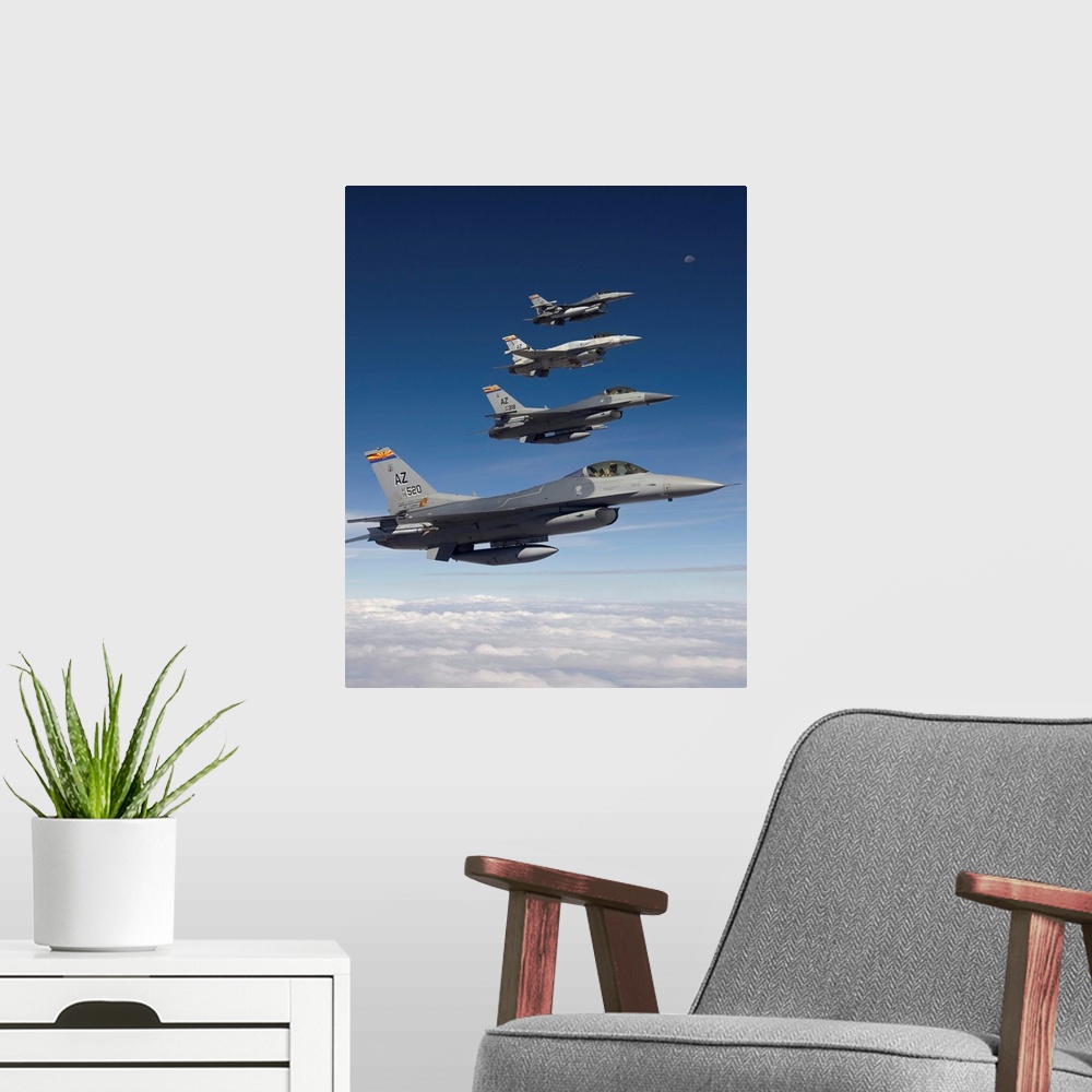 A modern room featuring Four F-16's stationed at the 162nd Fighter Wing in Tucson, Arizona, fly in formation during a tra...