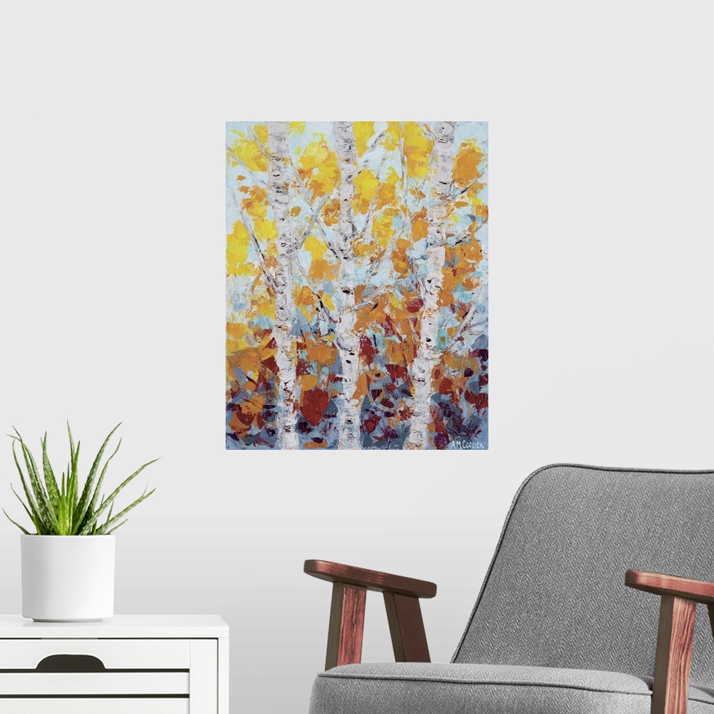 A modern room featuring Three white aspen trees with fall leaves.