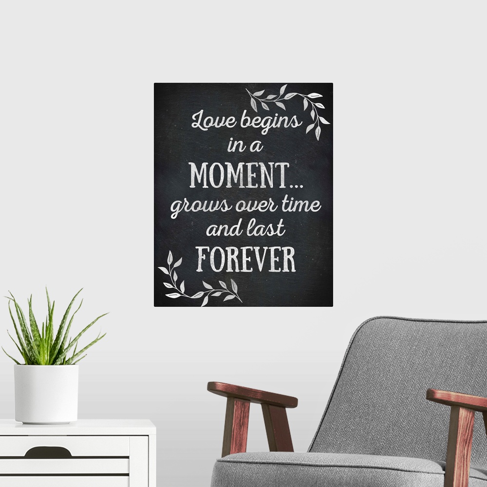 A modern room featuring Chalkboard sign that reads "Love begins in a Moment... grows over time and lasts Forever"