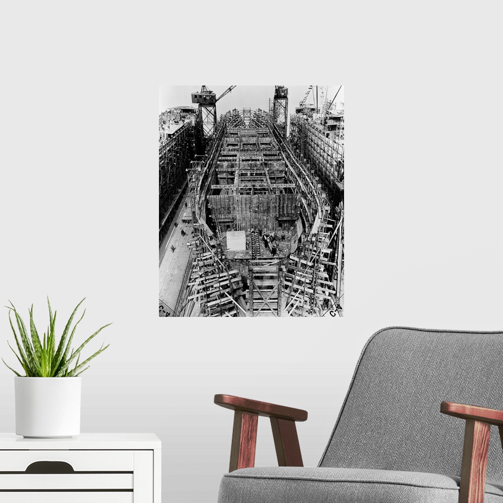 A modern room featuring A Liberty Ship under construction at the Bethlehem-Fairfield shipyard in Baltimore, Maryland. Pho...