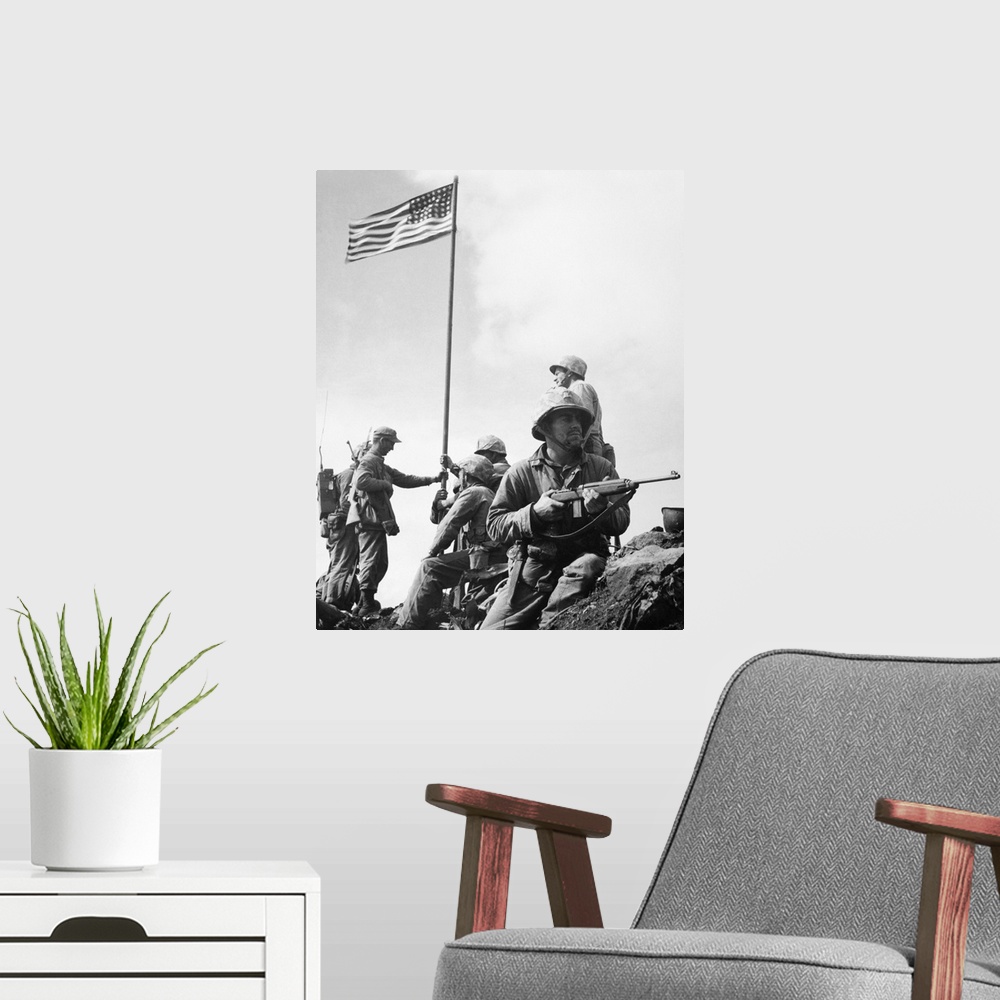 A modern room featuring The raising of the first flag on Mount Suribachi, Iwo Jima, 23 February 1945. The soldiers are Se...