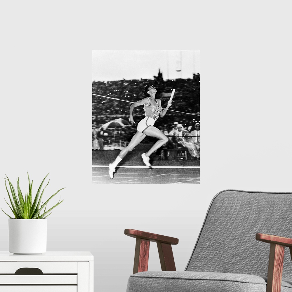 A modern room featuring American track and field athlete. Crossing the finish line to win the 400-meter relay for the Uni...