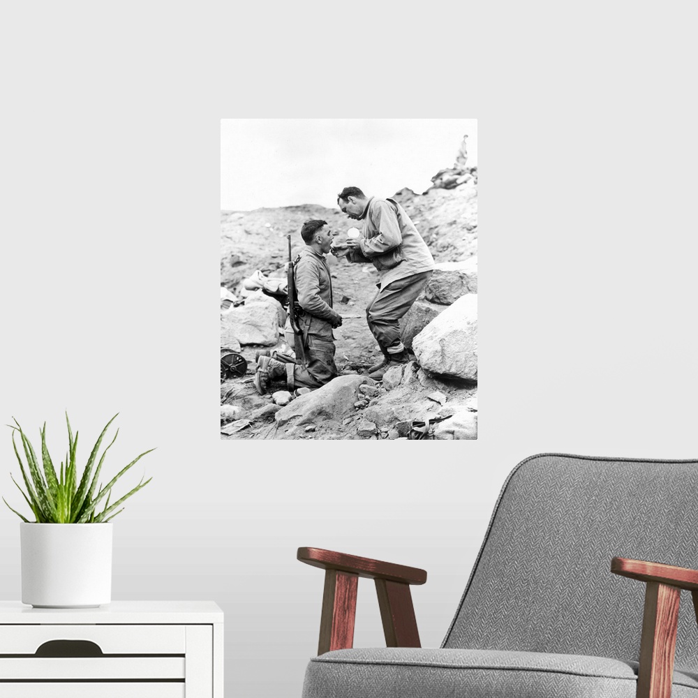 A modern room featuring An United States Marine receiving Communion on Iwo Jima, 1945.