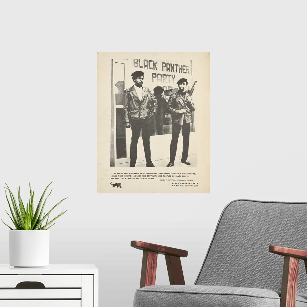A modern room featuring Framed black and white poster of Huey Newton and Bobby Seale in front of the storefront headquart...