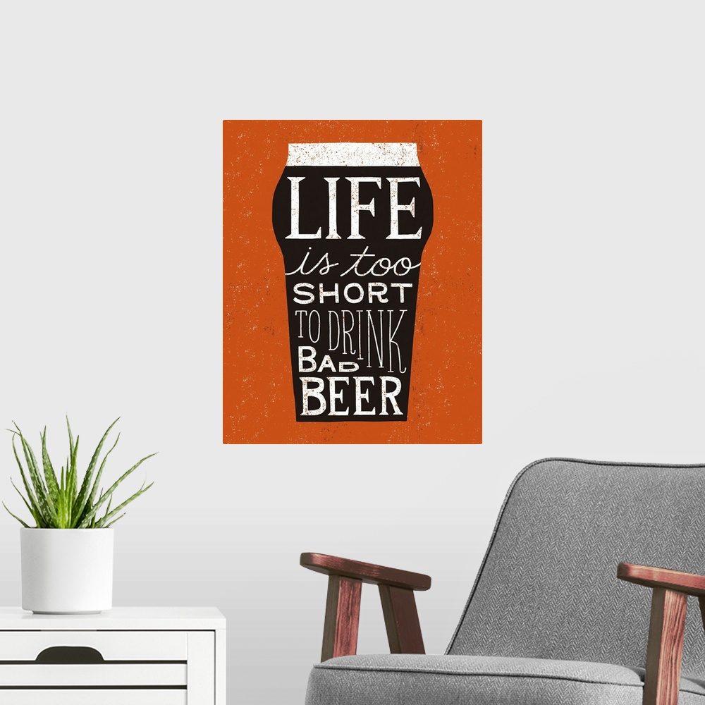 A modern room featuring Fun typography artwork in the shape of a beer glass.