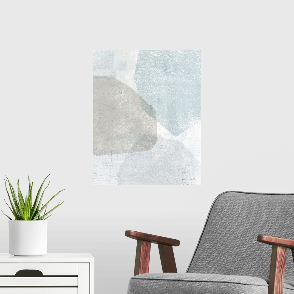 A modern room featuring Abstract painting with overlapping shapes in muted blue, white, and grey hues.