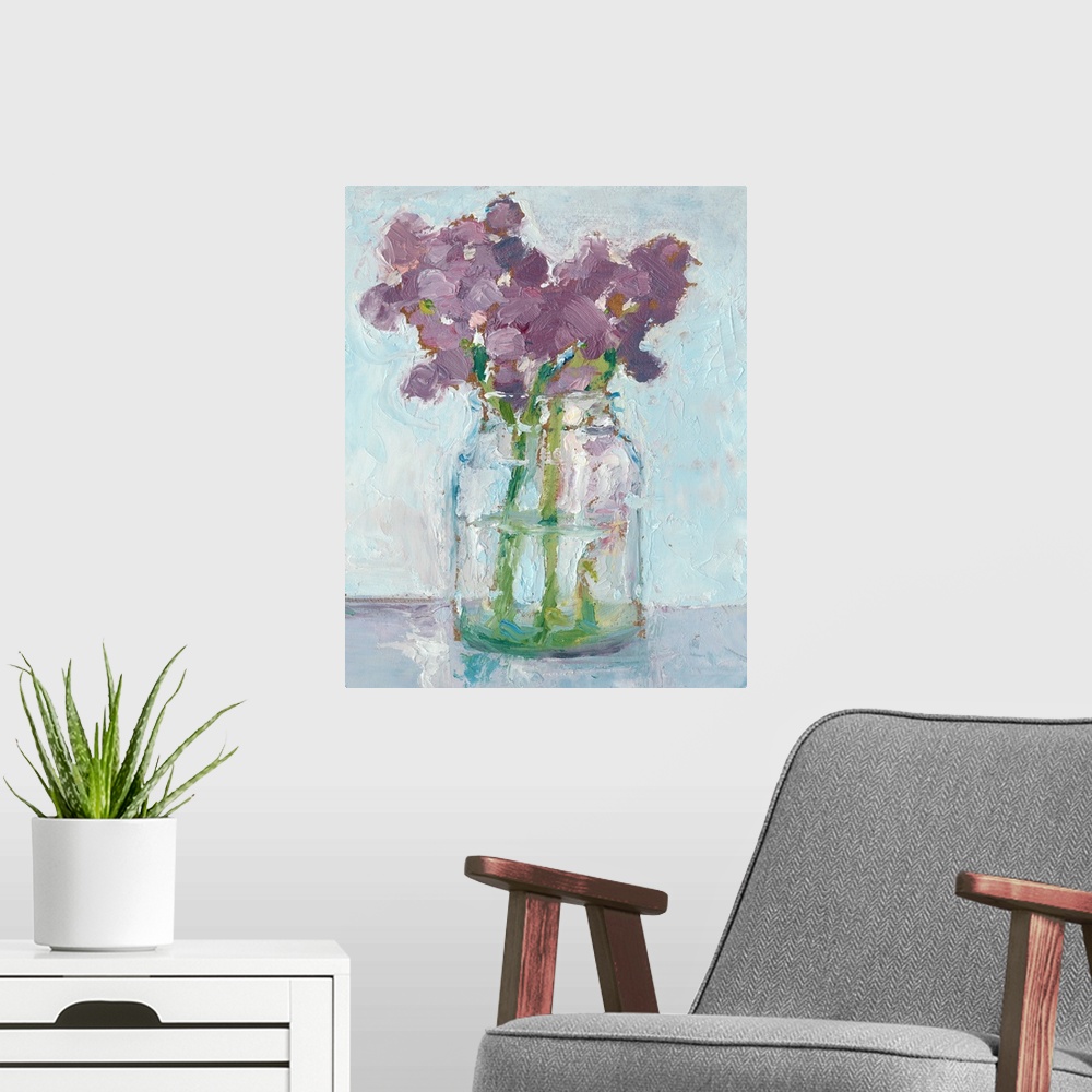 A modern room featuring Impressionist style art print of purple flowers in a glass vase.