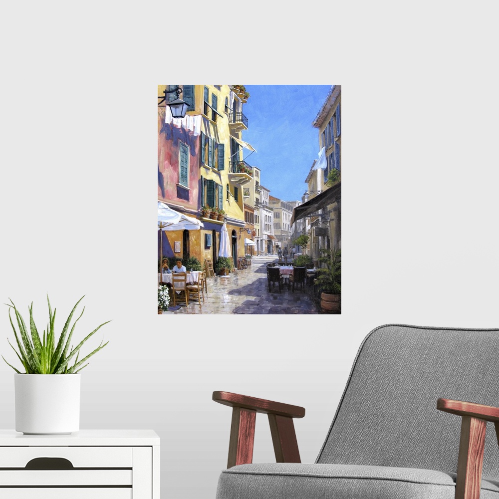 A modern room featuring Contemporary artwork of a street scene in the Italian town of Portofino.