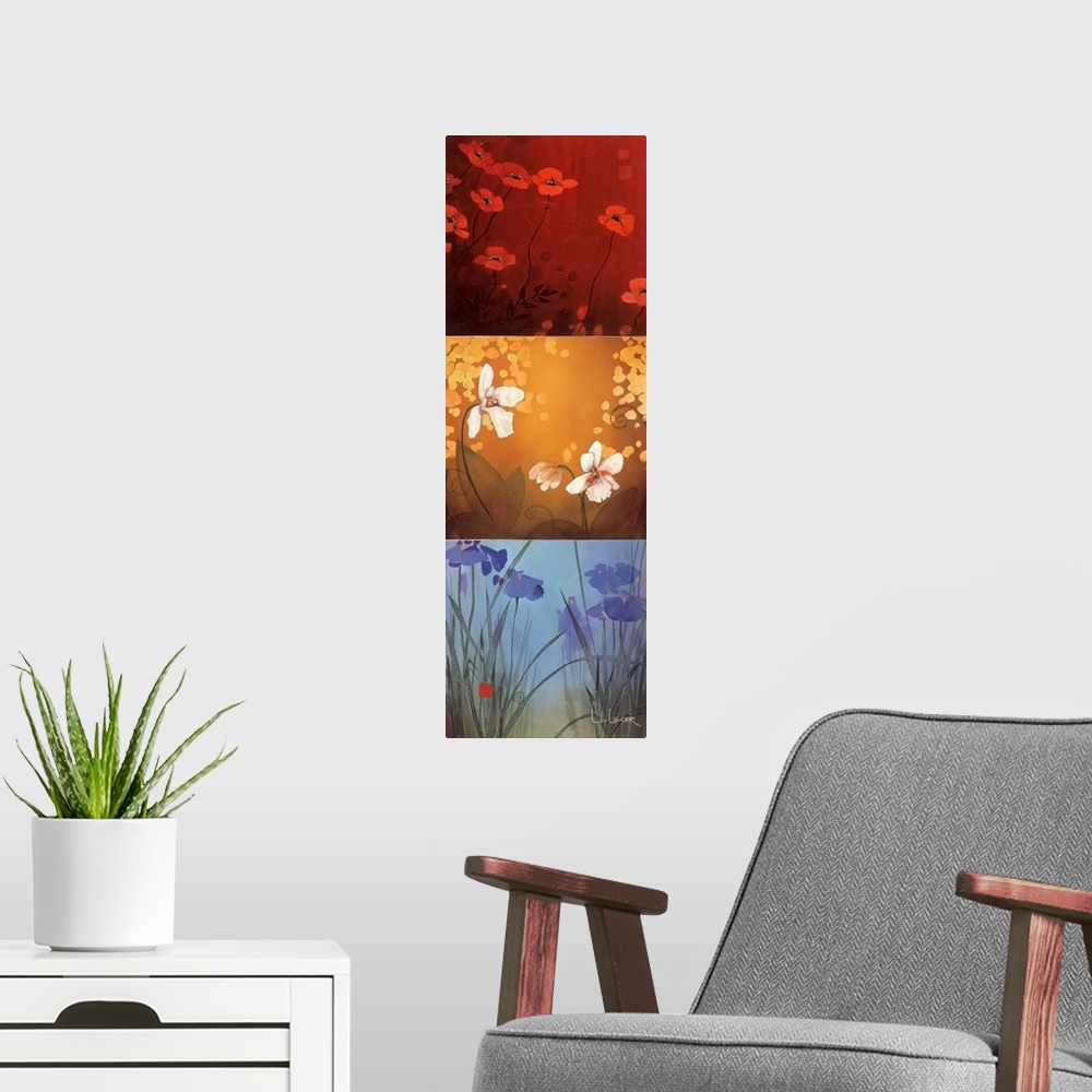 A modern room featuring A long vertical painting of flowers in three panels of red, yellow and blue.