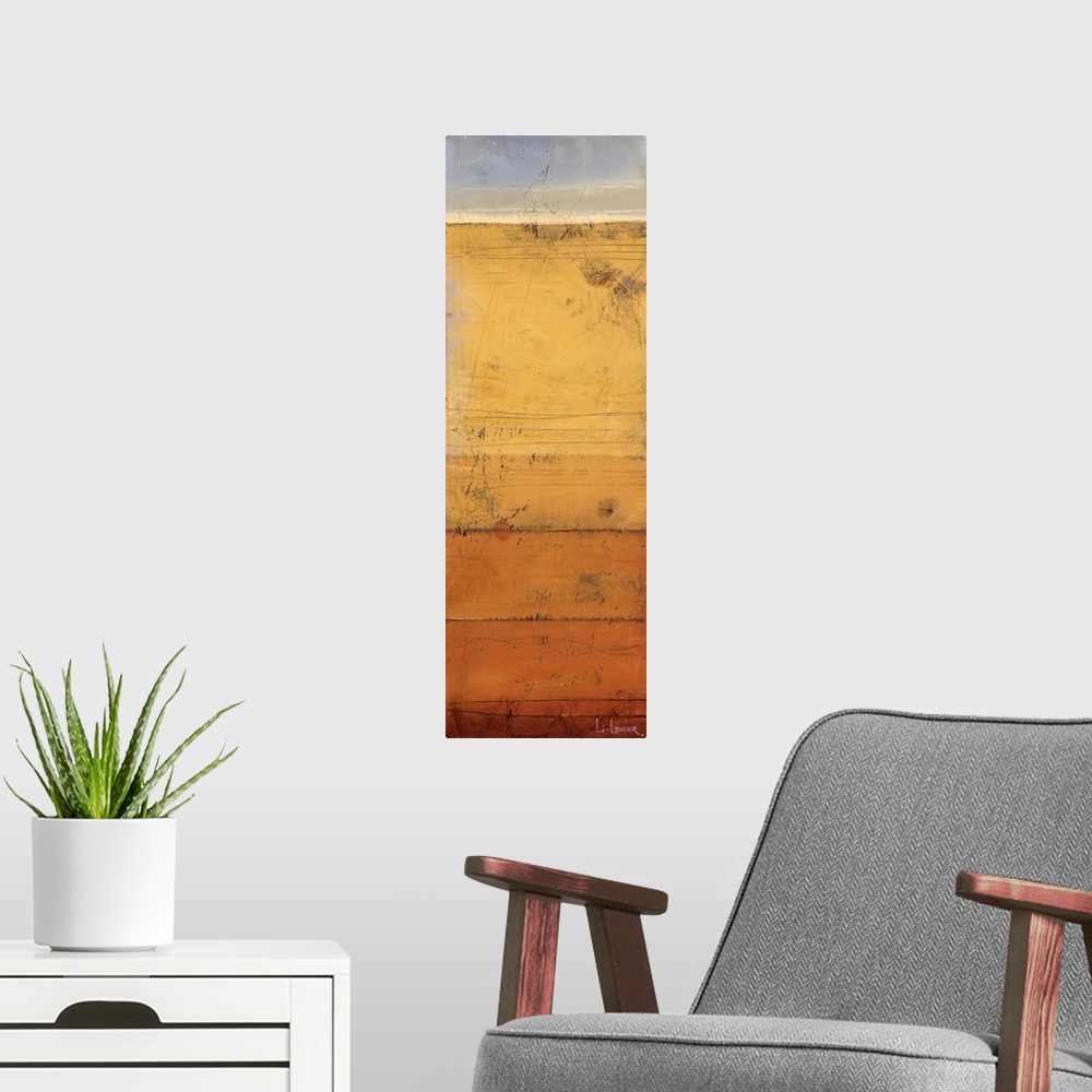 A modern room featuring A long vertical abstract is textured shades of orange, yellow and gray.