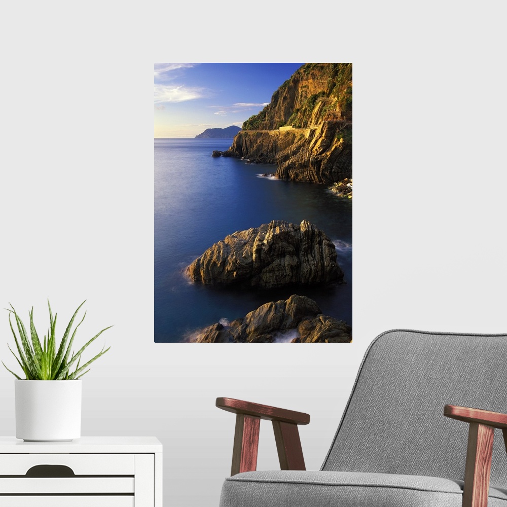 A modern room featuring The coastline with its cliffs and rock formations near Riomaggiore in the 5 Terre-Liguria-Italy.....