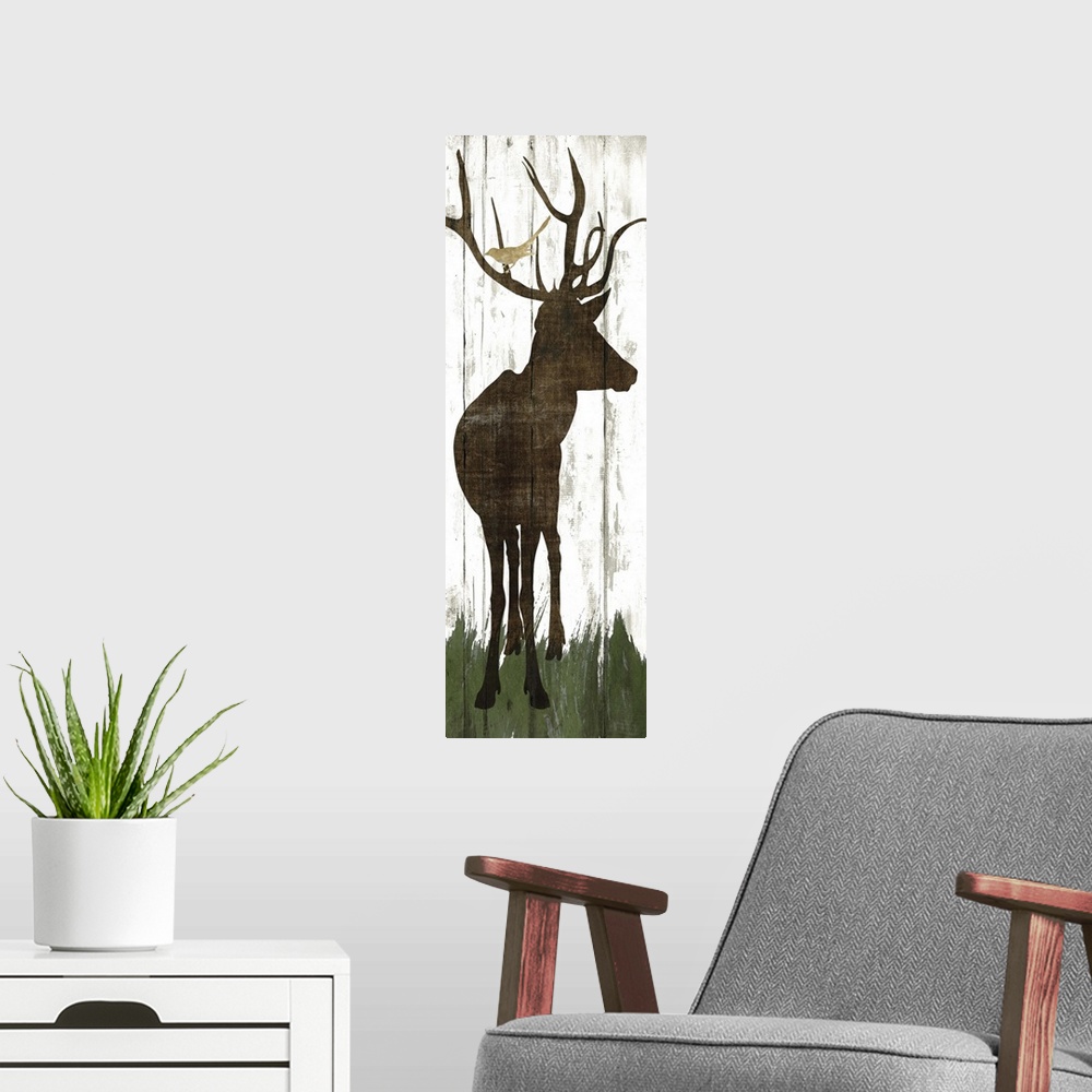 A modern room featuring Silhouette of a deer with birds in its antlers on a wooden board background.