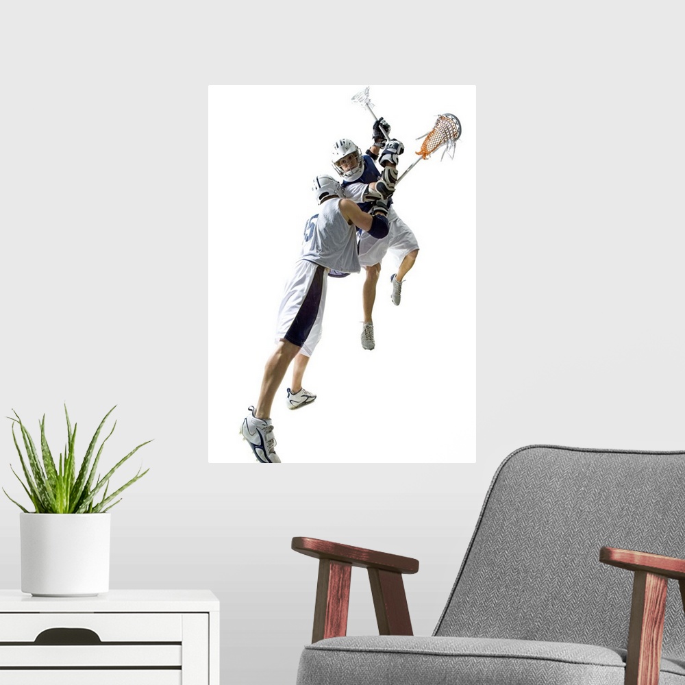 A modern room featuring Two young men playing lacrosse