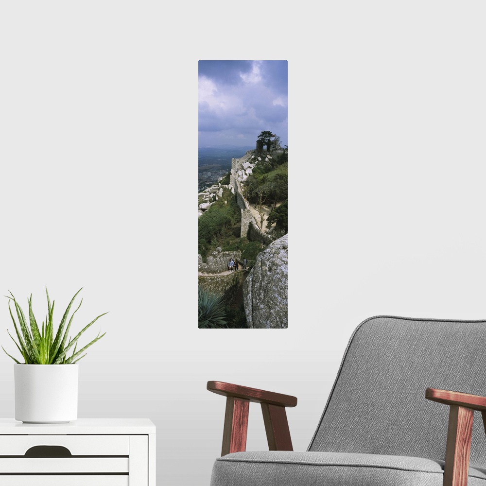 A modern room featuring High angle view of the old ruins of a castle, Castelo Dos Mouros, Sintra, Estremadura, Portugal