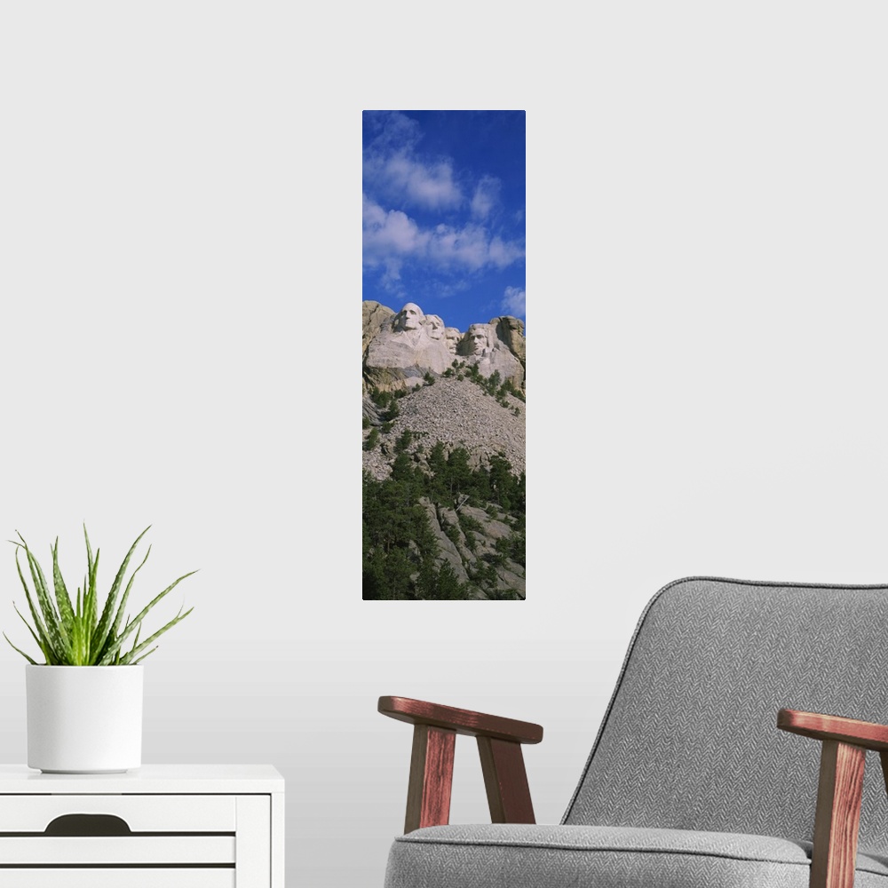 A modern room featuring Low angle view of sculptures of US presidents carved on the rocks of a mountain, Mt Rushmore Nati...