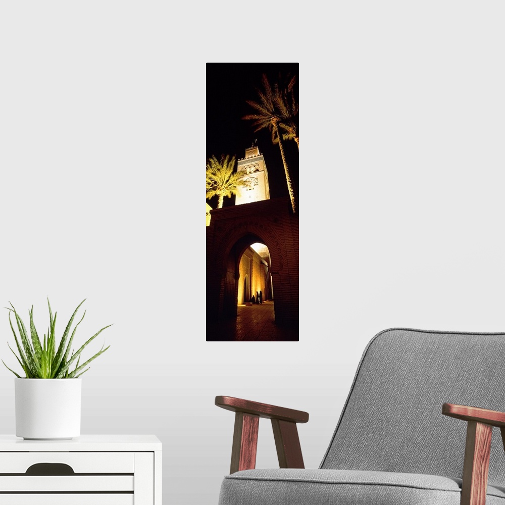 A modern room featuring Morocco, Marrakech, Koutoubia Minaret, night