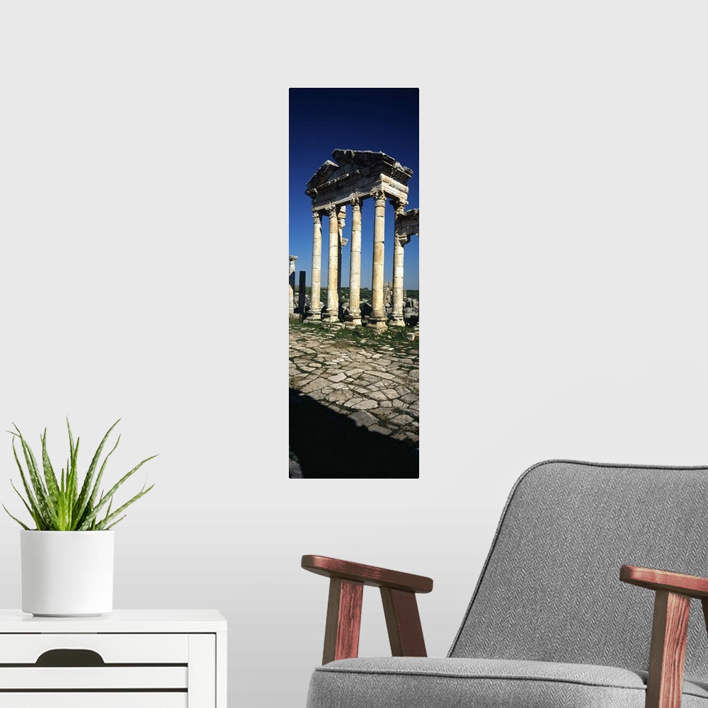 A modern room featuring Old ruins of a built structure, Entrance Columns, Apamea, Syria