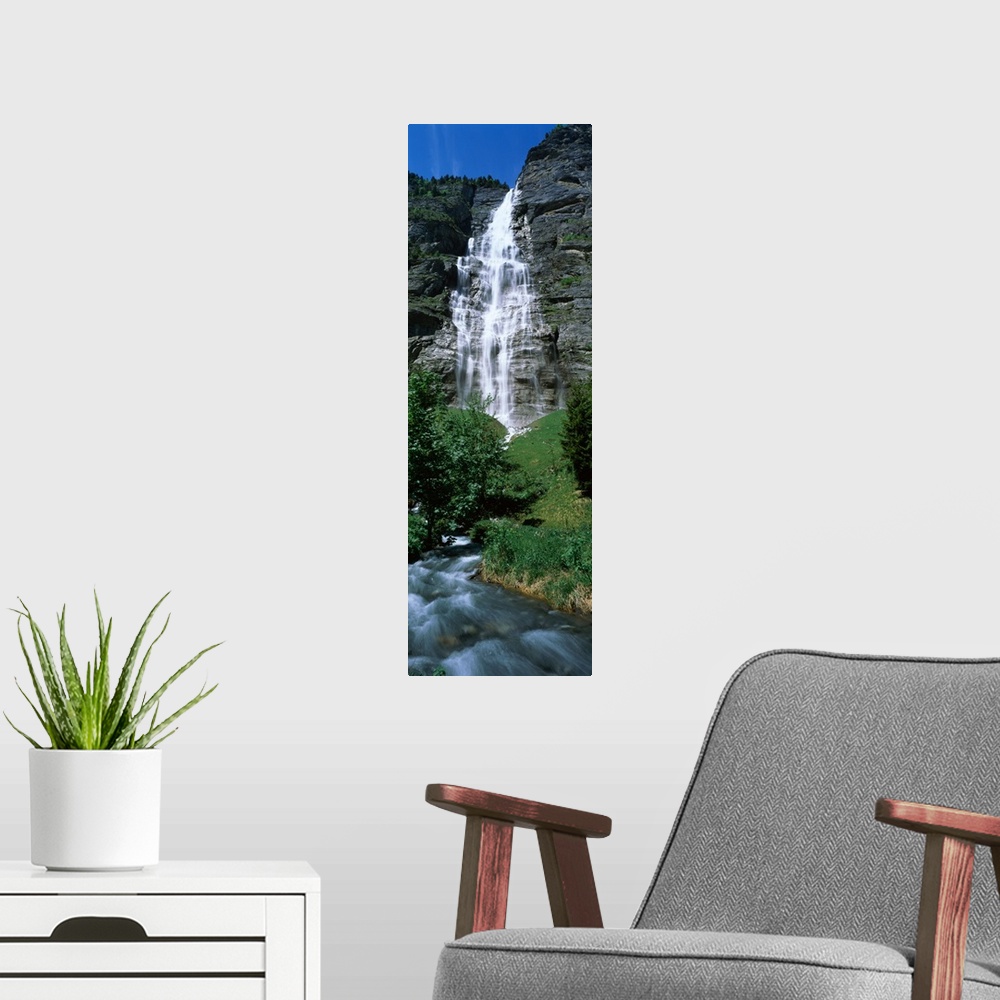 A modern room featuring Waterfall in a forest Murrenbach Falls Lauterbrunnen Valley Bernese Oberland Berne Canton Switzer...