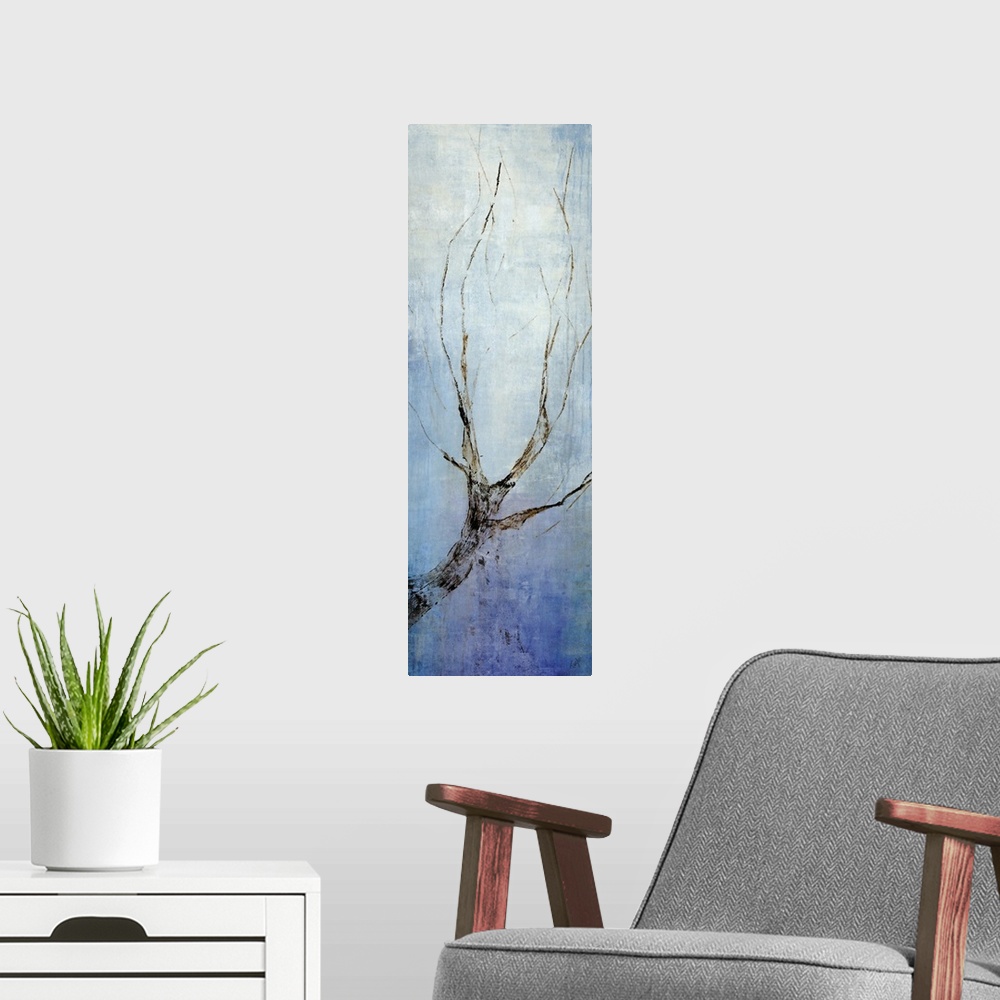 A modern room featuring Contemporary artwork with a single bare tree branch going vertically and a blue background.