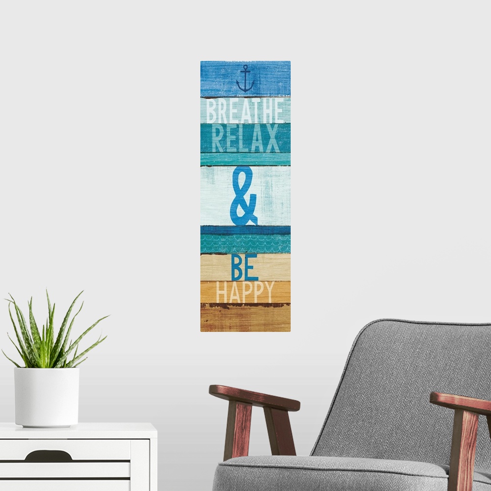 A modern room featuring "Breathe Relax and Be Happy" written on blue and tan rectangular shaped stained wood pieces.