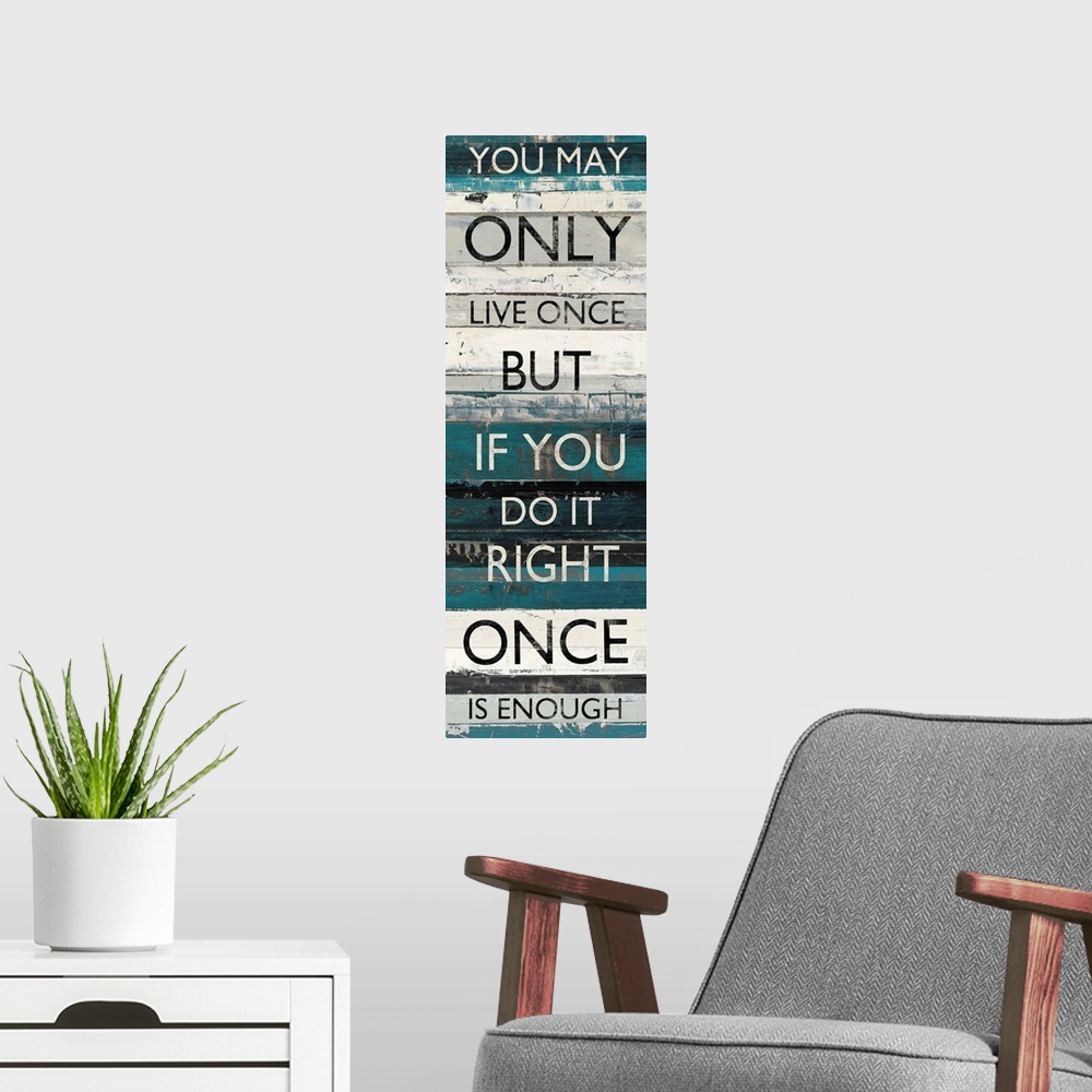 A modern room featuring Contemporary artwork of lines of text stacked vertically against a background of different blue t...