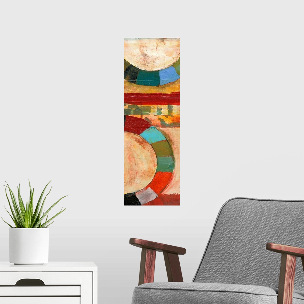 A modern room featuring Contemporary abstract painting featuring large rings of color in bright shades.