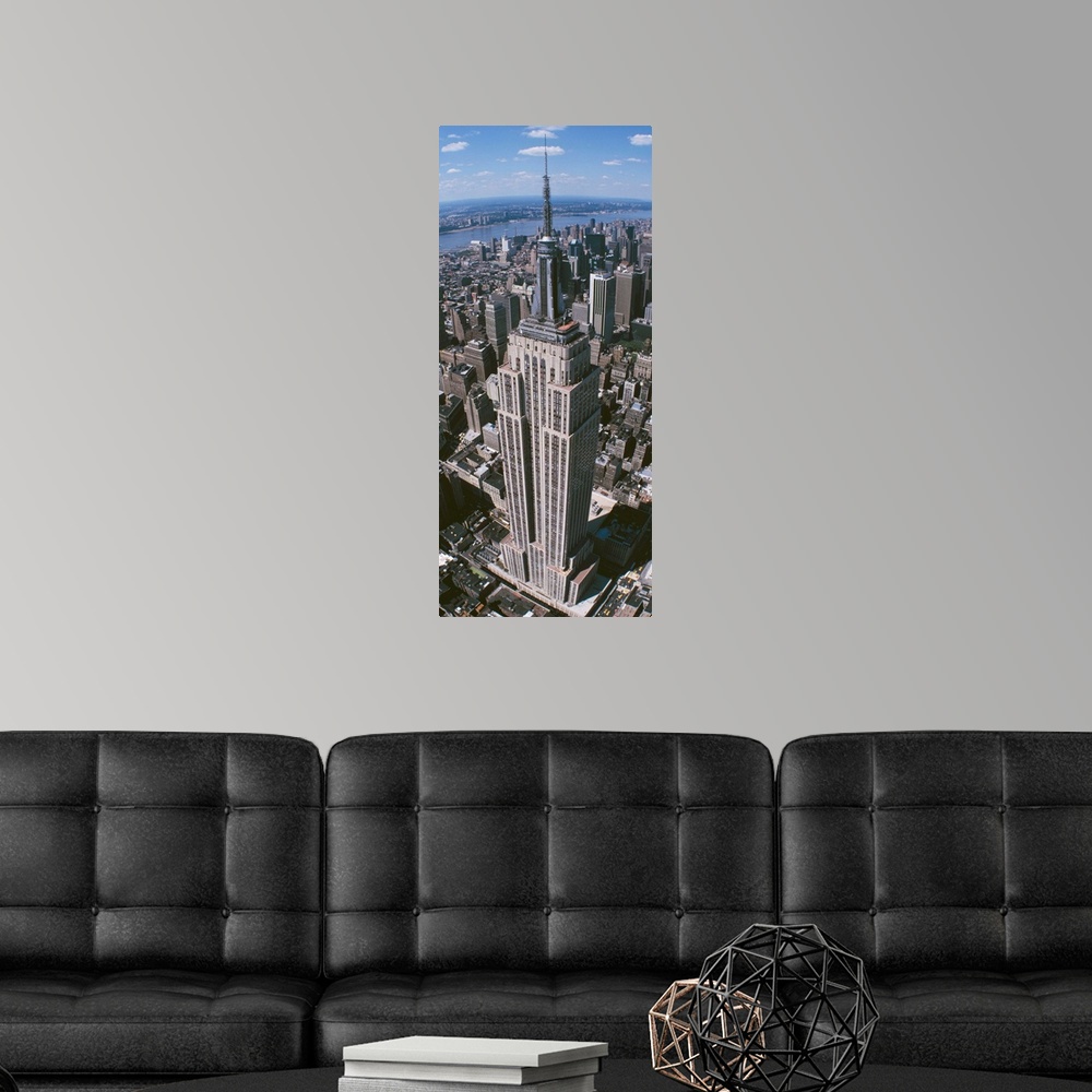 A modern room featuring Panoramic photograph taken from an aerial view focuses on a landmark skyscraper found within Manh...