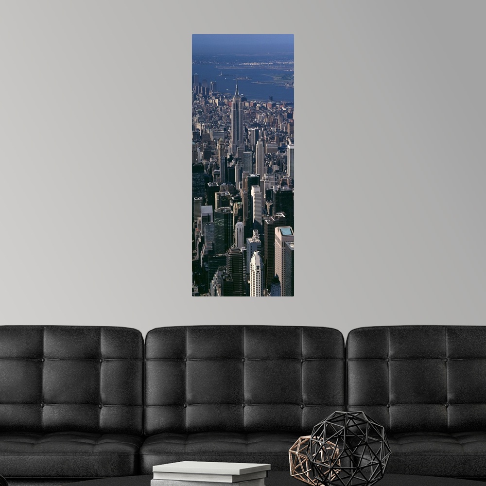 A modern room featuring Skyscrapers in New York City are photographed from an aerial view and in vertical orientation.