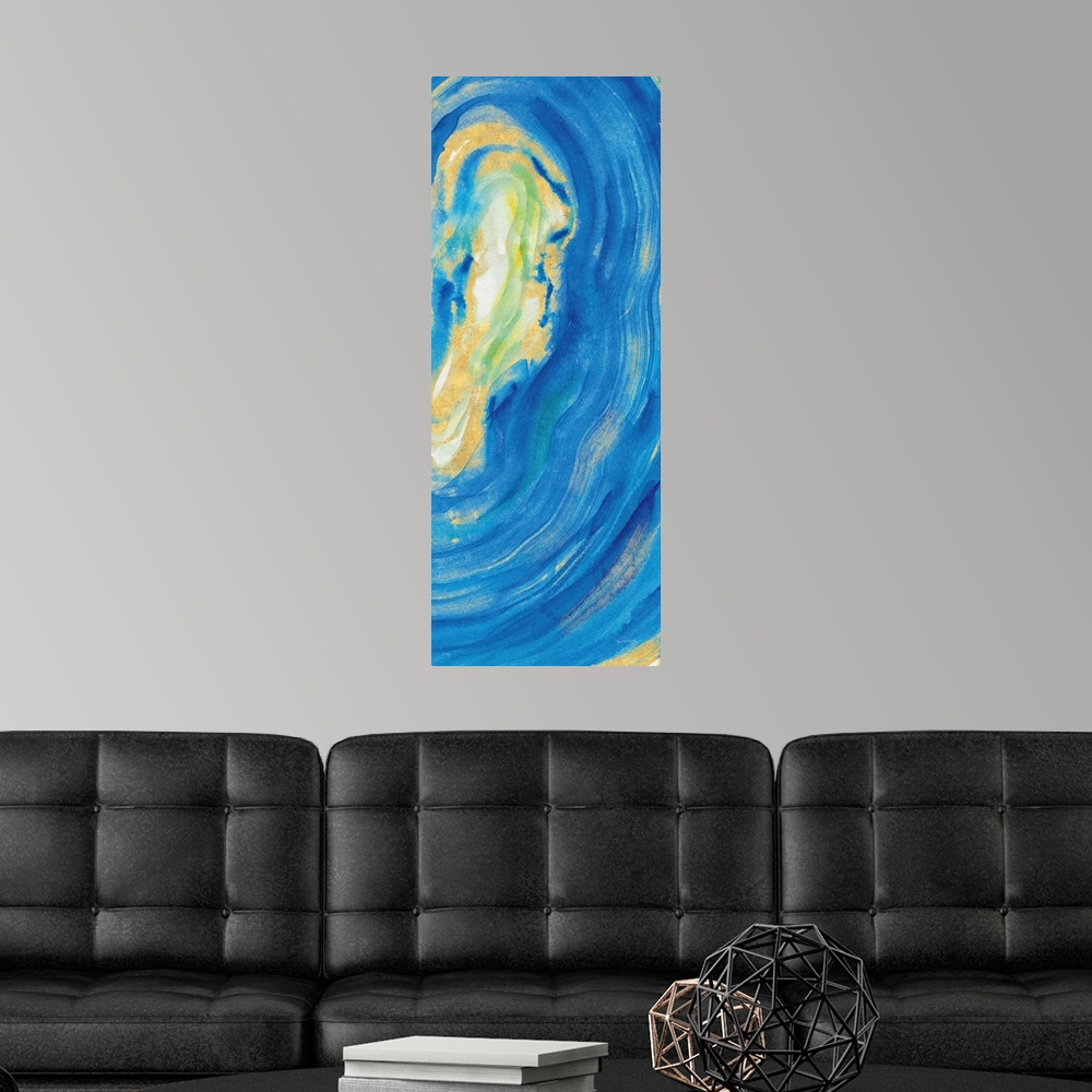 A modern room featuring Tall rectangular painting of the inside of a blue and gold mineral rock.