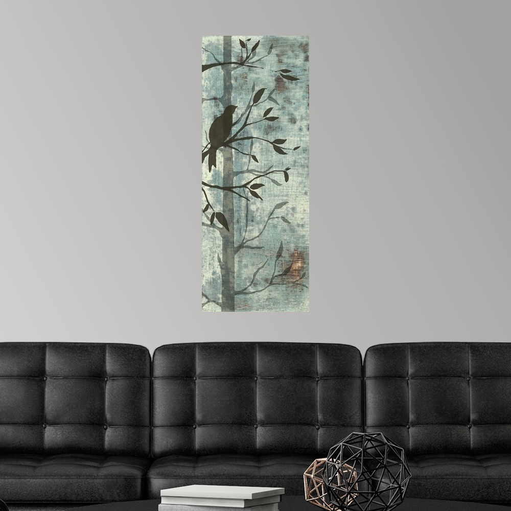 A modern room featuring Artwork of silhouetted birds and trees against a pale teal background.