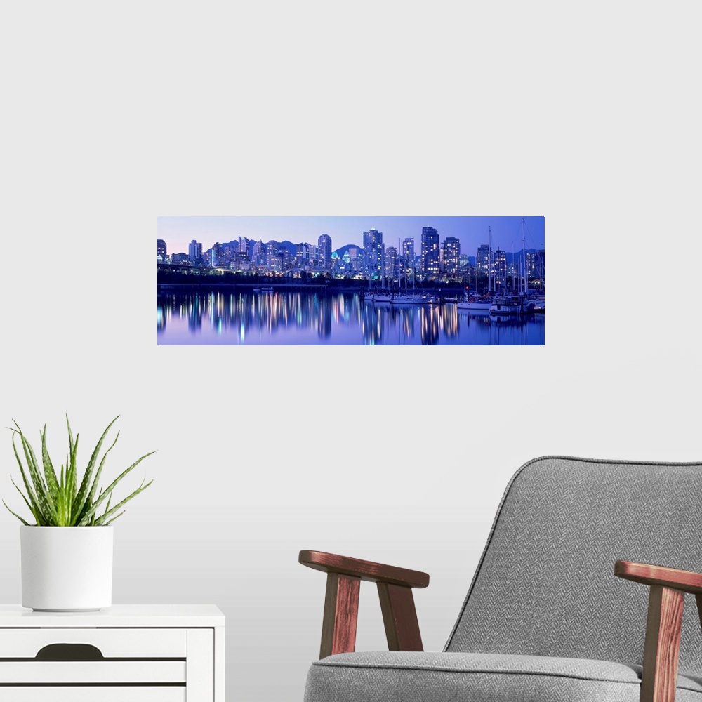 A modern room featuring False Creek Skyline, Twilight, Vancouver, British Columbia, Canada