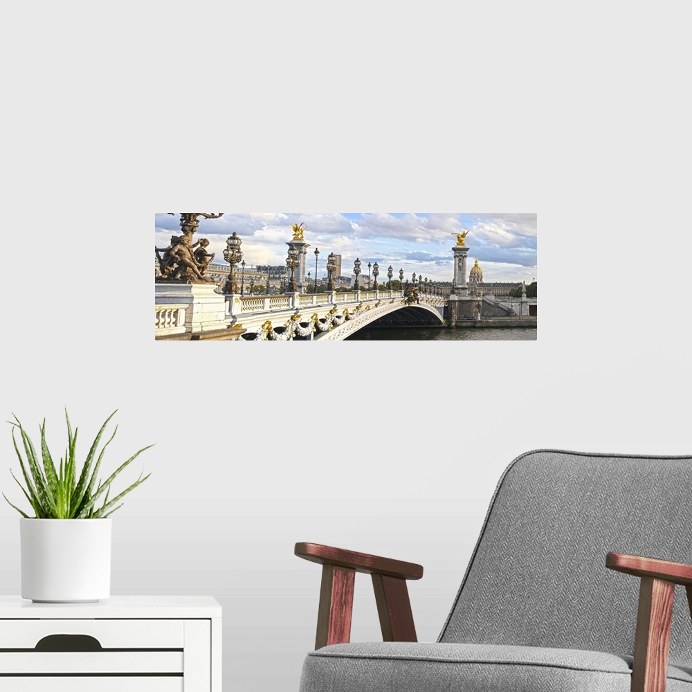A modern room featuring Panoramic view of the Alexandre III bridge in Paris, France.