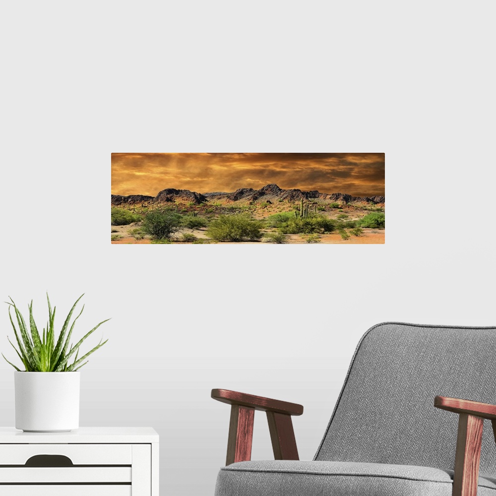 A modern room featuring Beautiful panorama of cloud formations and rocky mountains near the border of New Mexico and Mexico.